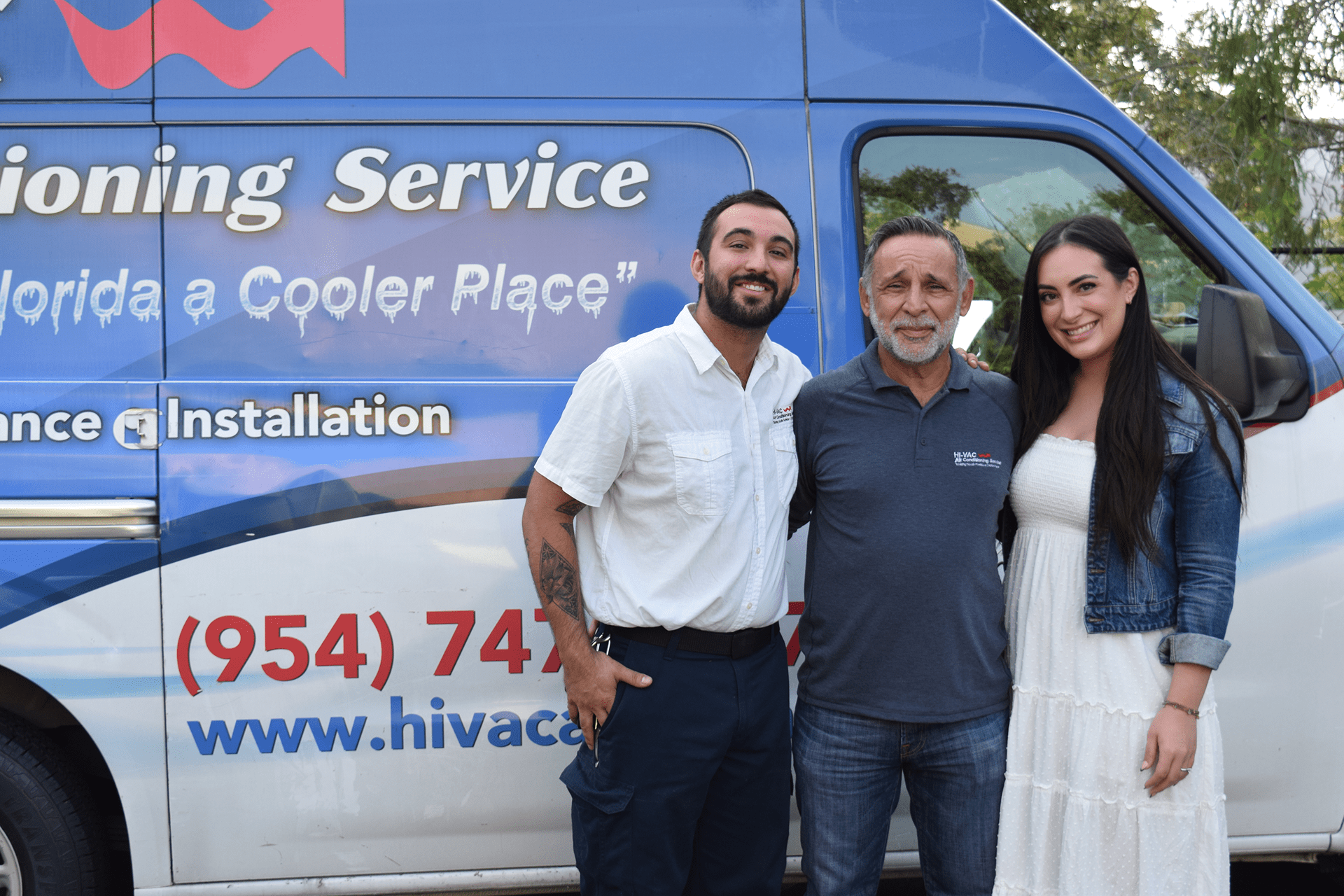 Family in front of van